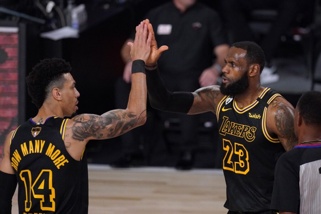 Game over. LeBron James and Danny Green High Five each other. They are wearing special Kobe jerseys in the 2020 NBA Bubble.